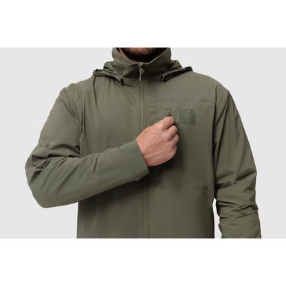 Front close-up photo of the Tomahawk Performance Crosswind Jacket, a tactical windbreaker, depicting the chest pocket and attachment point in Ranger Green color way.