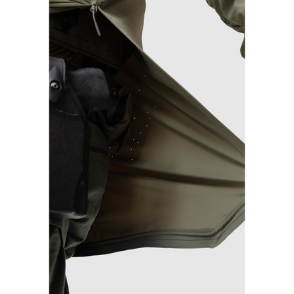 Close-up photo of the Tomahawk Performance Overlayer Anorak's interior lining featuring laser perforated panels for ventilation in Ranger Green color way.