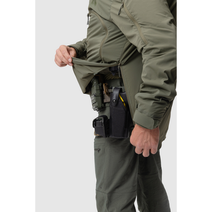 Close-up photo of the photo of the Tomahawk Performance Overlayer Anorak in Ranger Green's side zippered opening for easy donning and doffing.